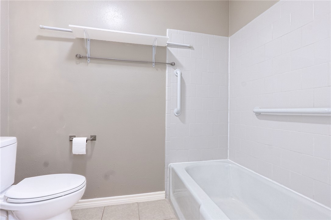 2316 Kent Street Bryan, TX 77802 - Photo 21 of 31 a white bath tub sitting next to a white toilet
