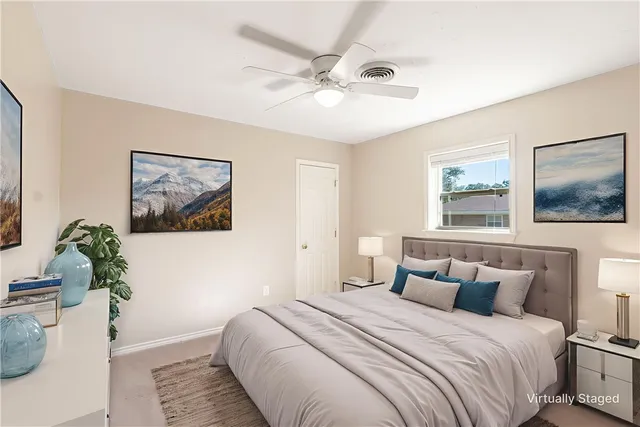 a bedroom with bed and window