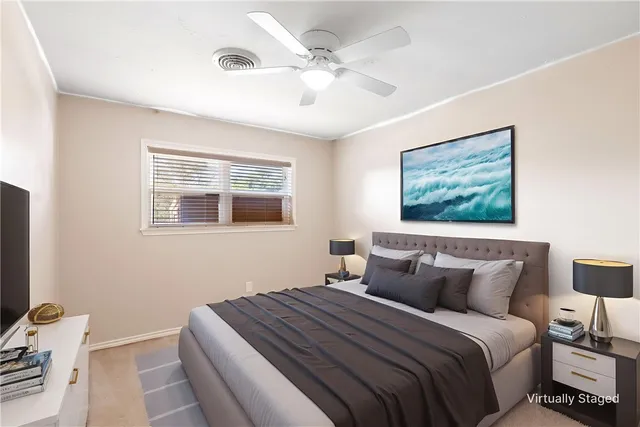 a bedroom with bed and window