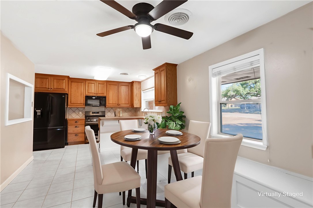 2316 Kent Street Bryan, TX 77802 - Photo 4 of 31 a view of a dining room with furniture and a window