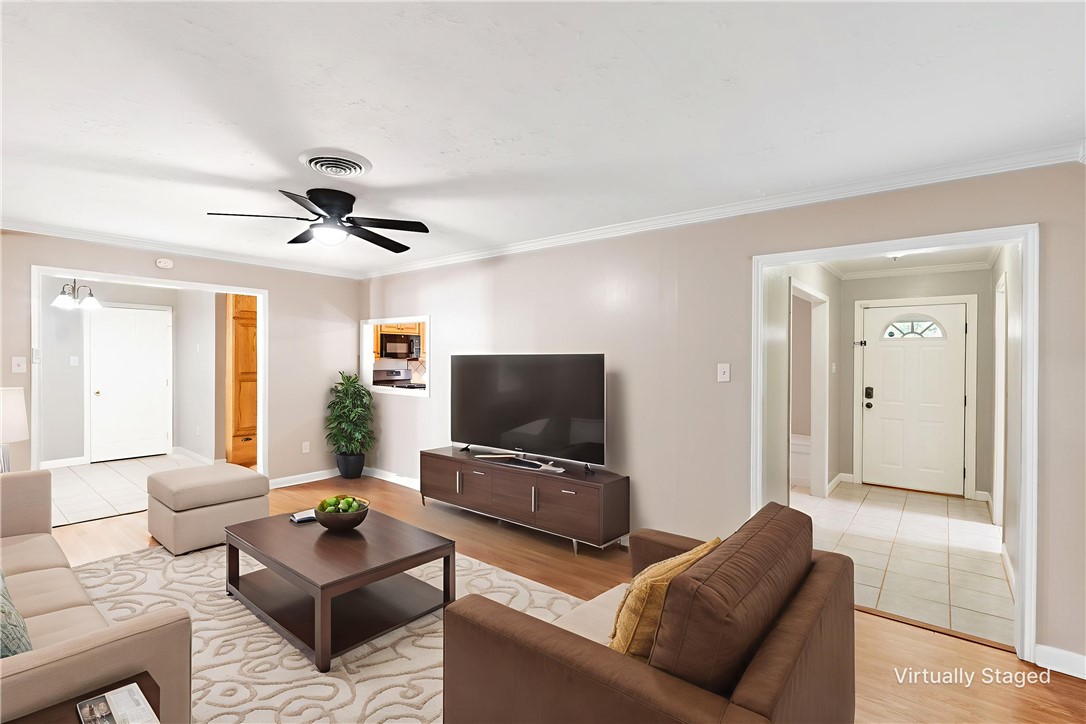 2316 Kent Street Bryan, TX 77802 - Photo 7 of 31 a living room with furniture and a flat screen tv