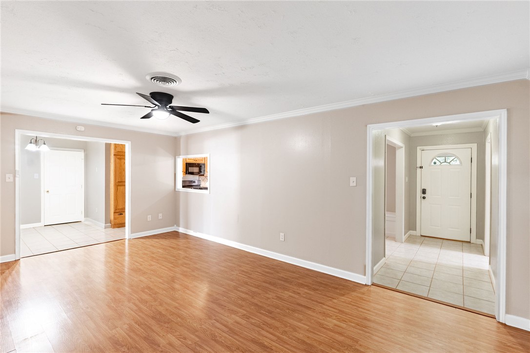 2316 Kent Street Bryan, TX 77802 - Photo 8 of 31 an empty room with wooden floor and windows