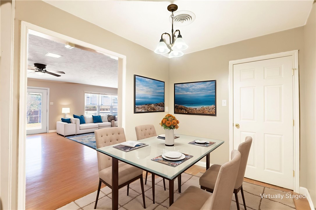 2316 Kent Street Bryan, TX 77802 - Photo 10 of 31 a view of a dining room with furniture and wooden floor