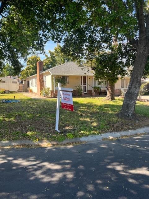 22030 Hibiscus Drive Cupertino, CA 95014 - Photo 2 of 5 a house that has a tree in front of it