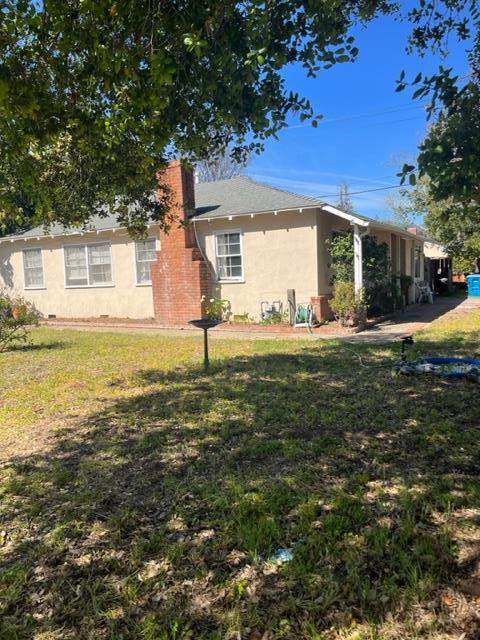 22030 Hibiscus Drive Cupertino, CA 95014 - Photo 4 of 5 a view of a house with a yard