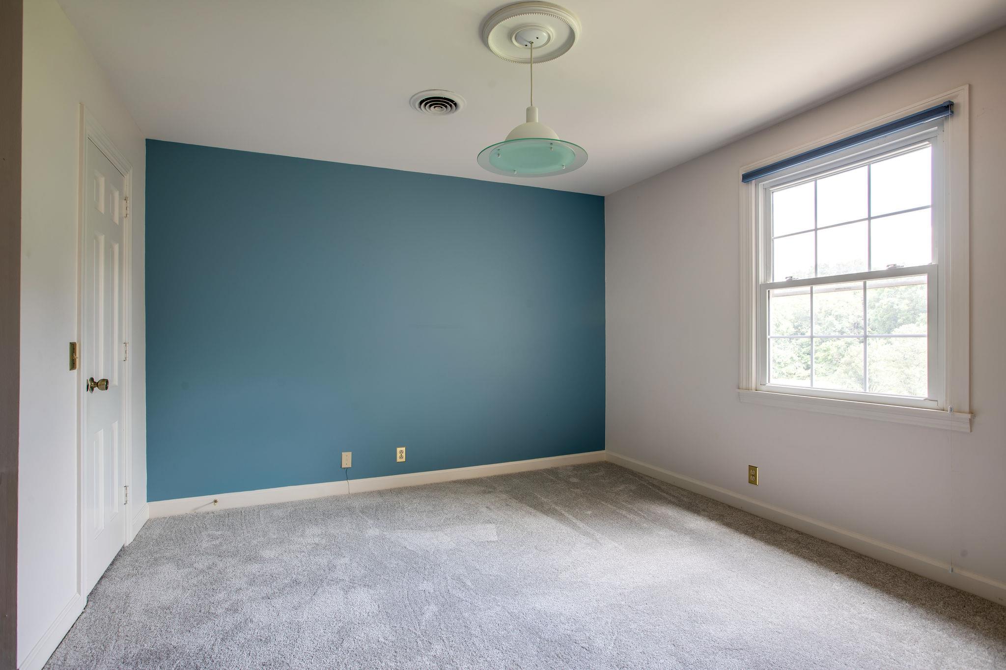 6737 Holt Road Nashville, TN 37211 - Photo 17 of 28 Bedroom 2 upstairs (the light fixture does not remain-it will be replaced)There is a built in desk and shelves (not pictured.Also access to one of the large attic areas