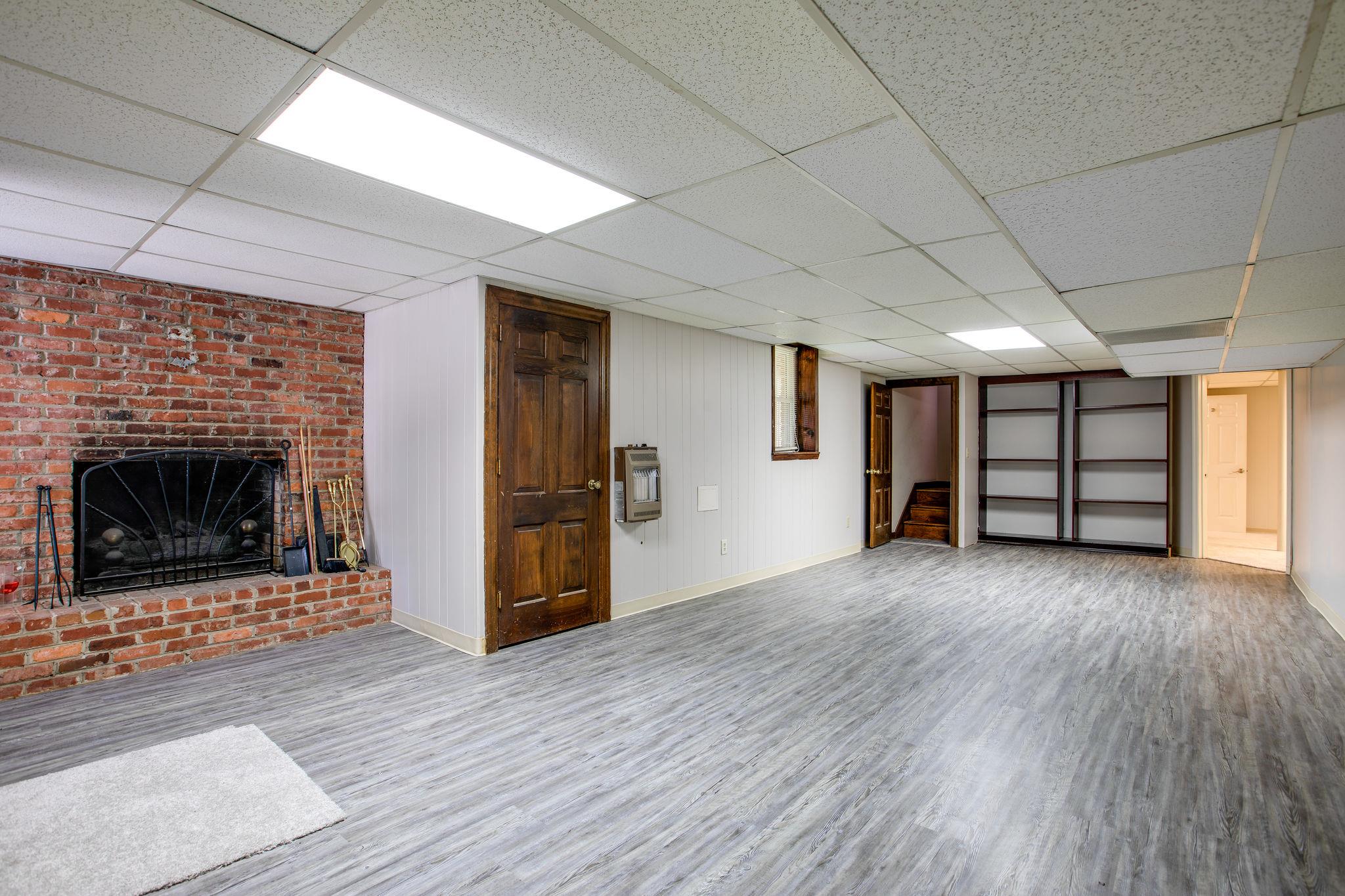 6737 Holt Road Nashville, TN 37211 - Photo 22 of 28 Lower level Bonus Room with fireplace