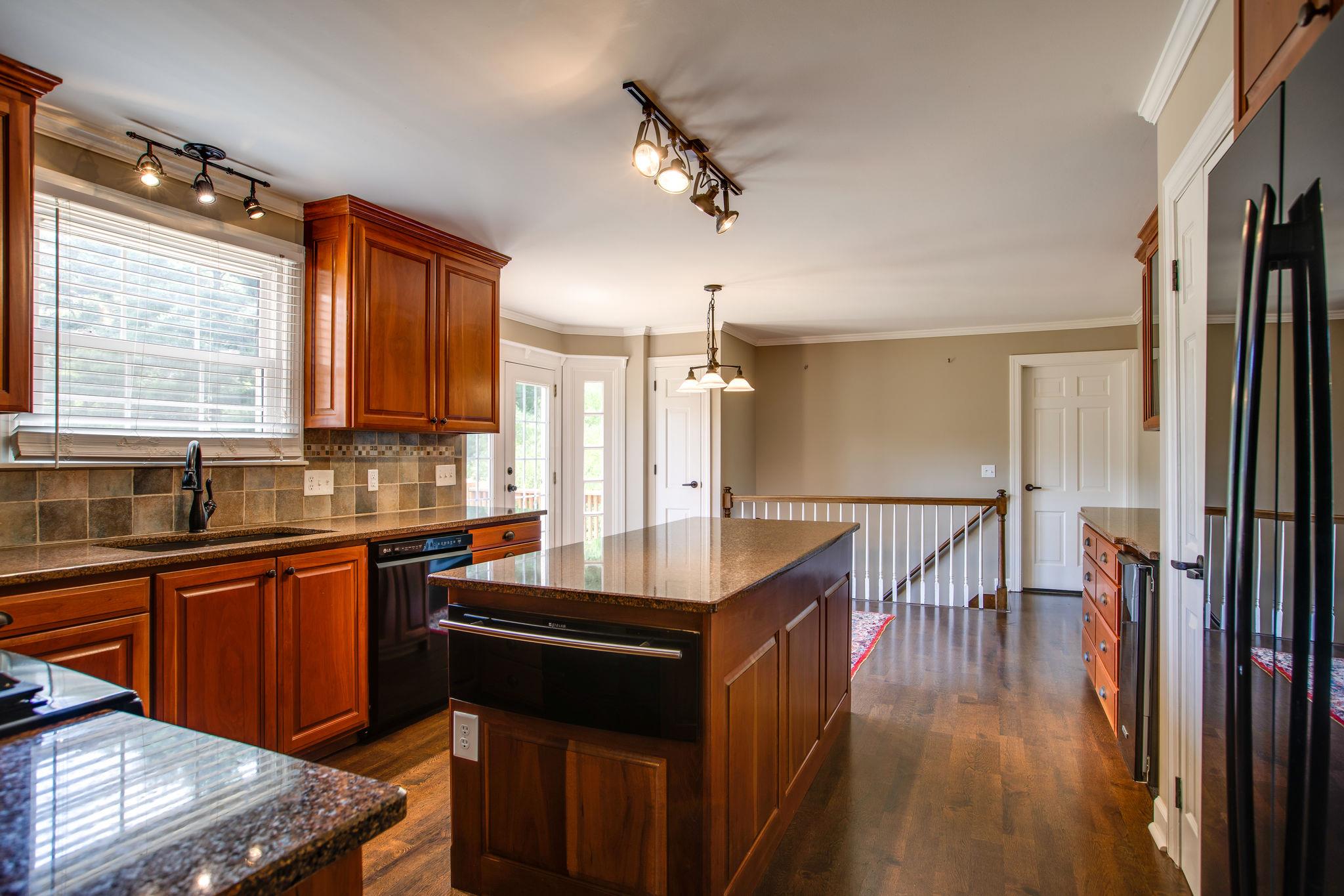 6737 Holt Road Nashville, TN 37211 - Photo 8 of 28 The Cook's dream Kitchen is open to the Breakfast area.There is a gas range,warning drawer,microwave and even the refrigerator remains!