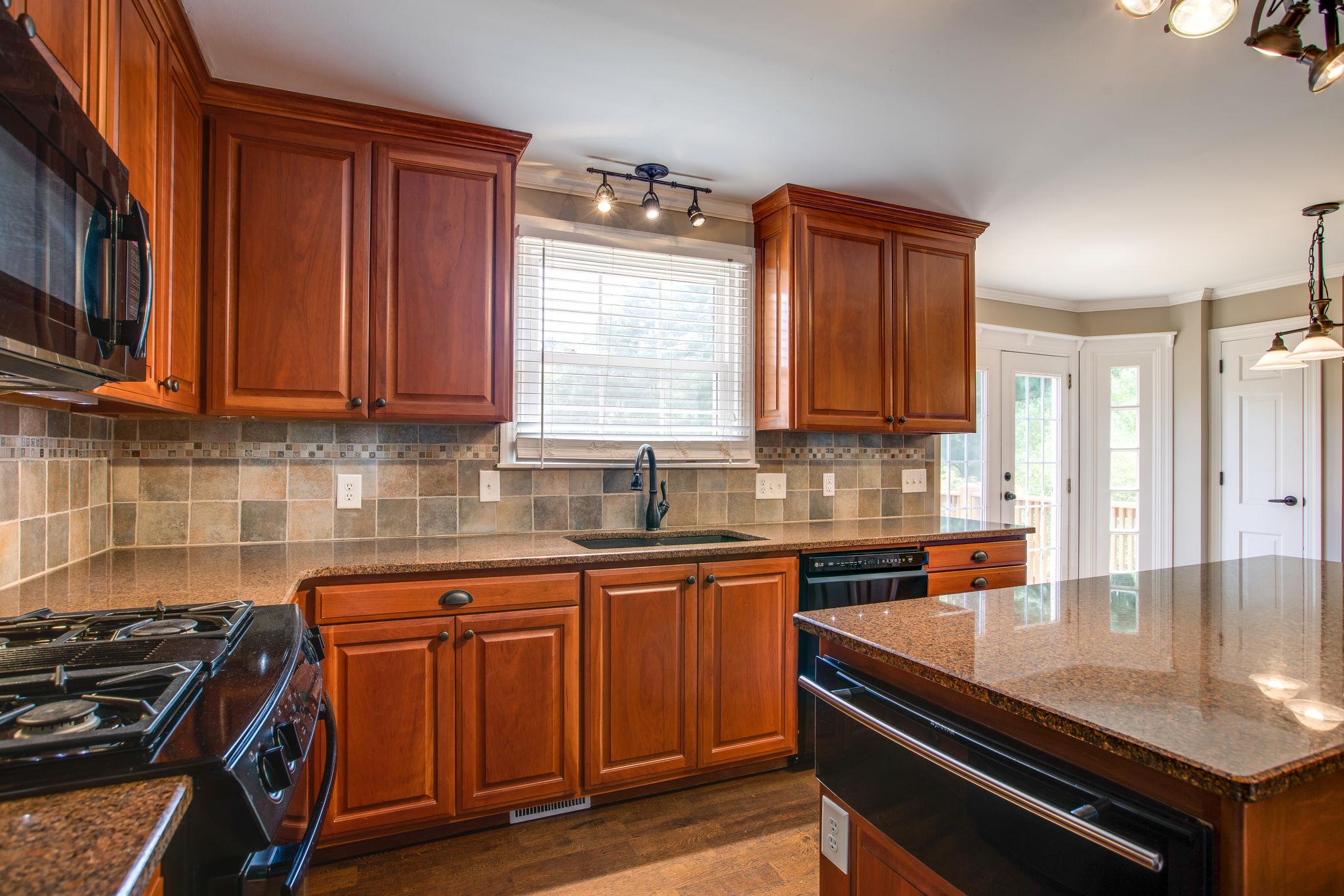 6737 Holt Road Nashville, TN 37211 - Photo 9 of 28 Beautiful custom cabinets with granite counter tops and ceramic backsplash
