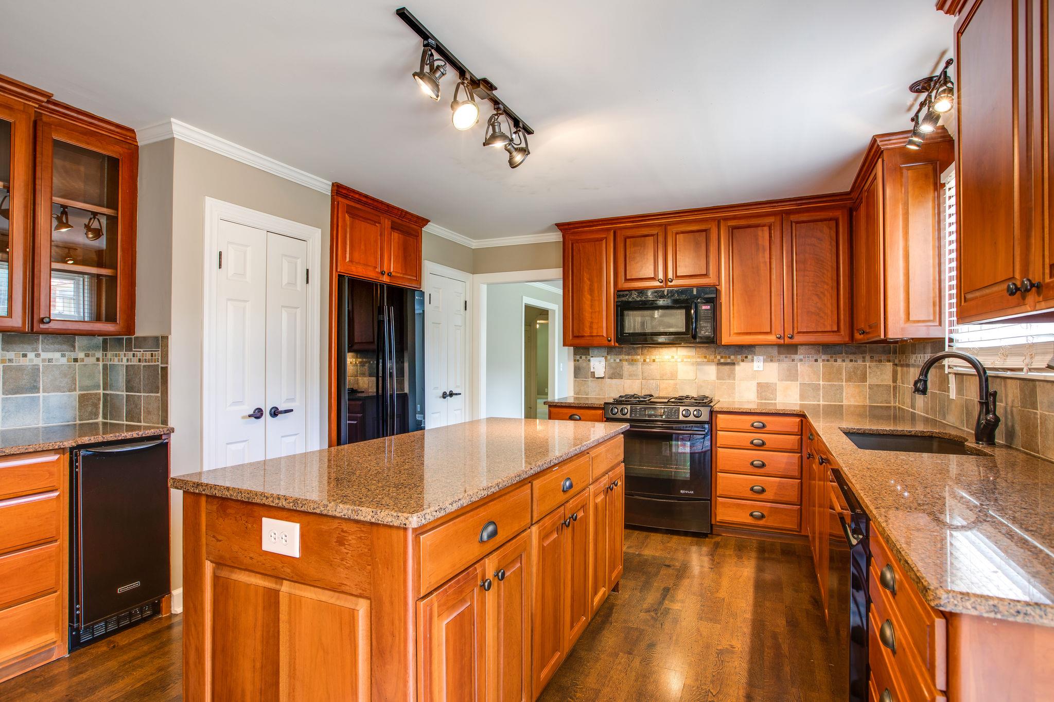 6737 Holt Road Nashville, TN 37211 - Photo 10 of 28 In addition to the abundant cabinet storage,there are 2 reach-in pantries,pus a storage closet near the staircase