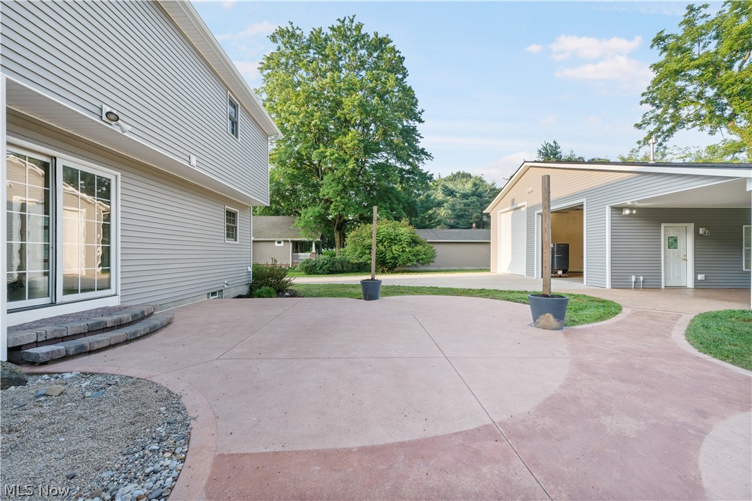 1239 Congress Lake Road Mogadore, OH 44260 - Photo 30 of 35 View of patio featuring a garage