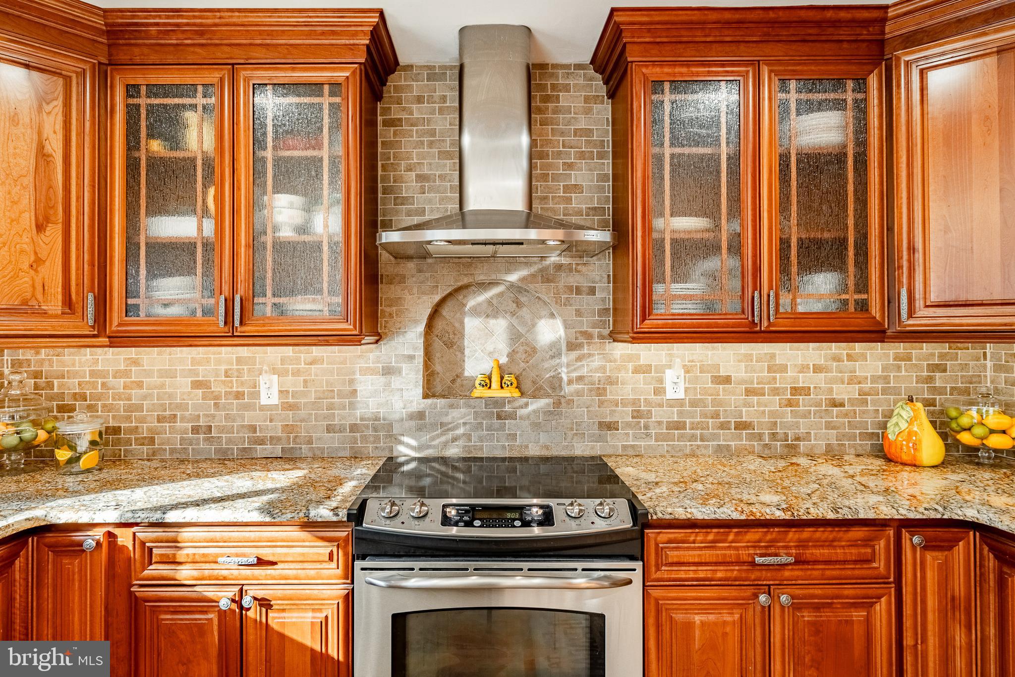 3920 Darby Road Bryn Mawr, PA 19010 - Photo 15 of 54 a kitchen with stainless steel appliances granite countertop a stove and a sink
