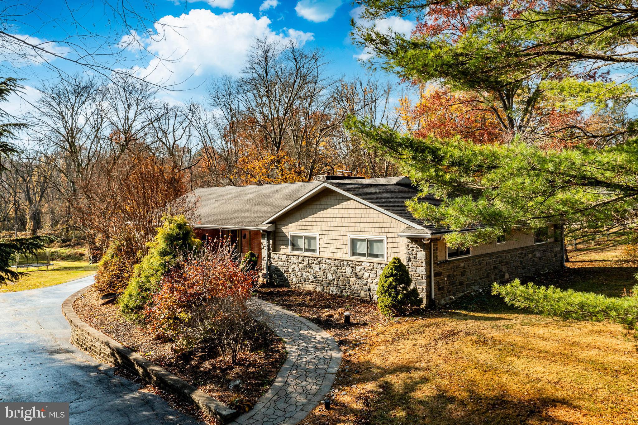 3920 Darby Road Bryn Mawr, PA 19010 - Photo 2 of 54 a front view of a house with garden