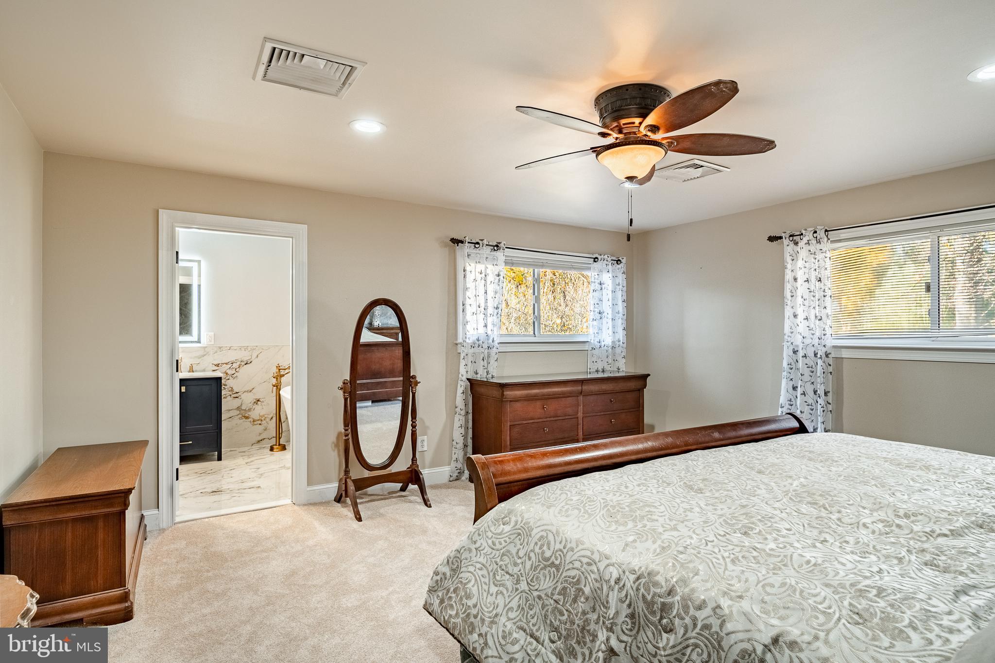 3920 Darby Road Bryn Mawr, PA 19010 - Photo 23 of 54 a bedroom with a bed and a chandelier