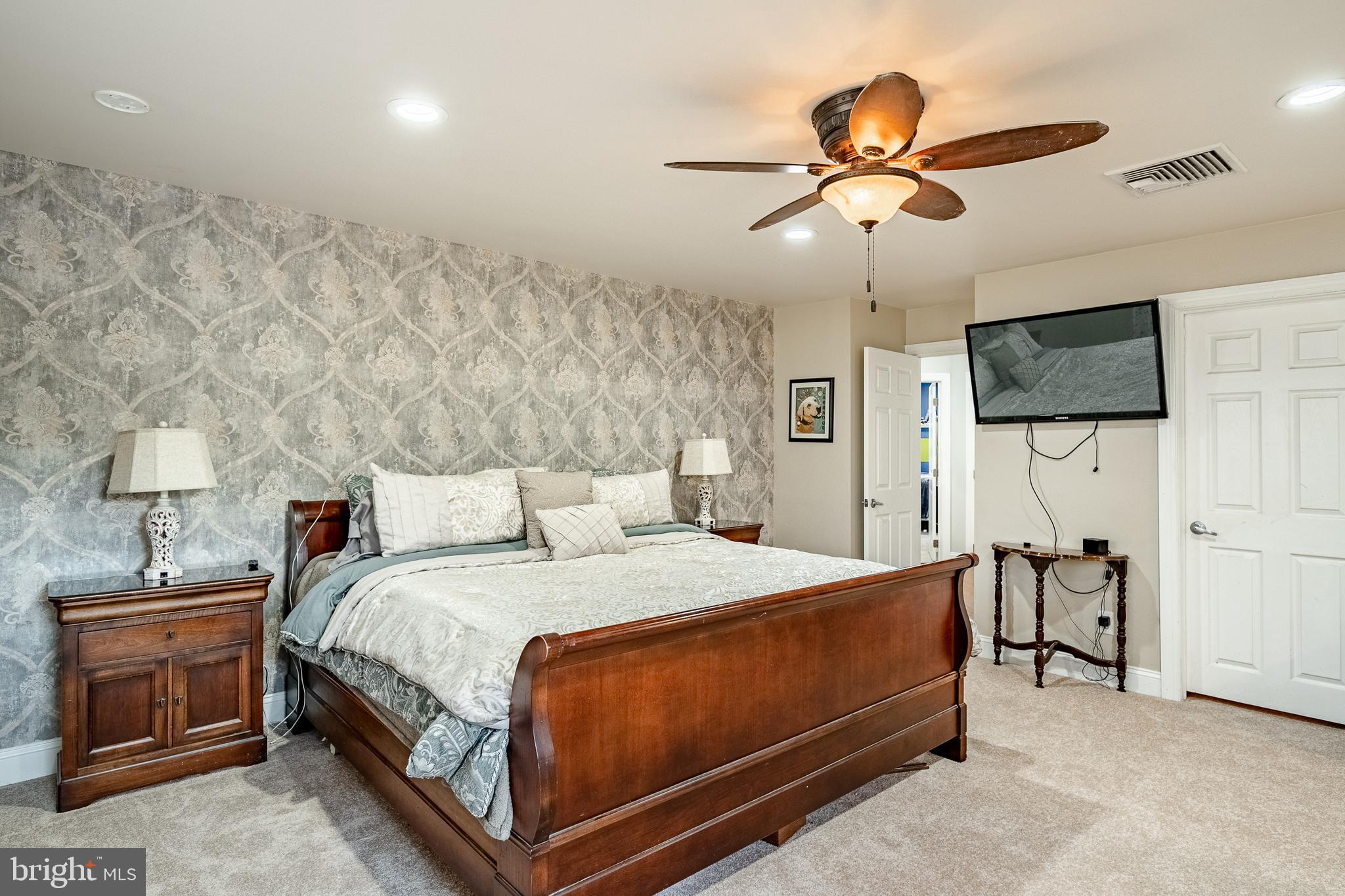 3920 Darby Road Bryn Mawr, PA 19010 - Photo 25 of 54 a bedroom with a bed and a flat screen tv