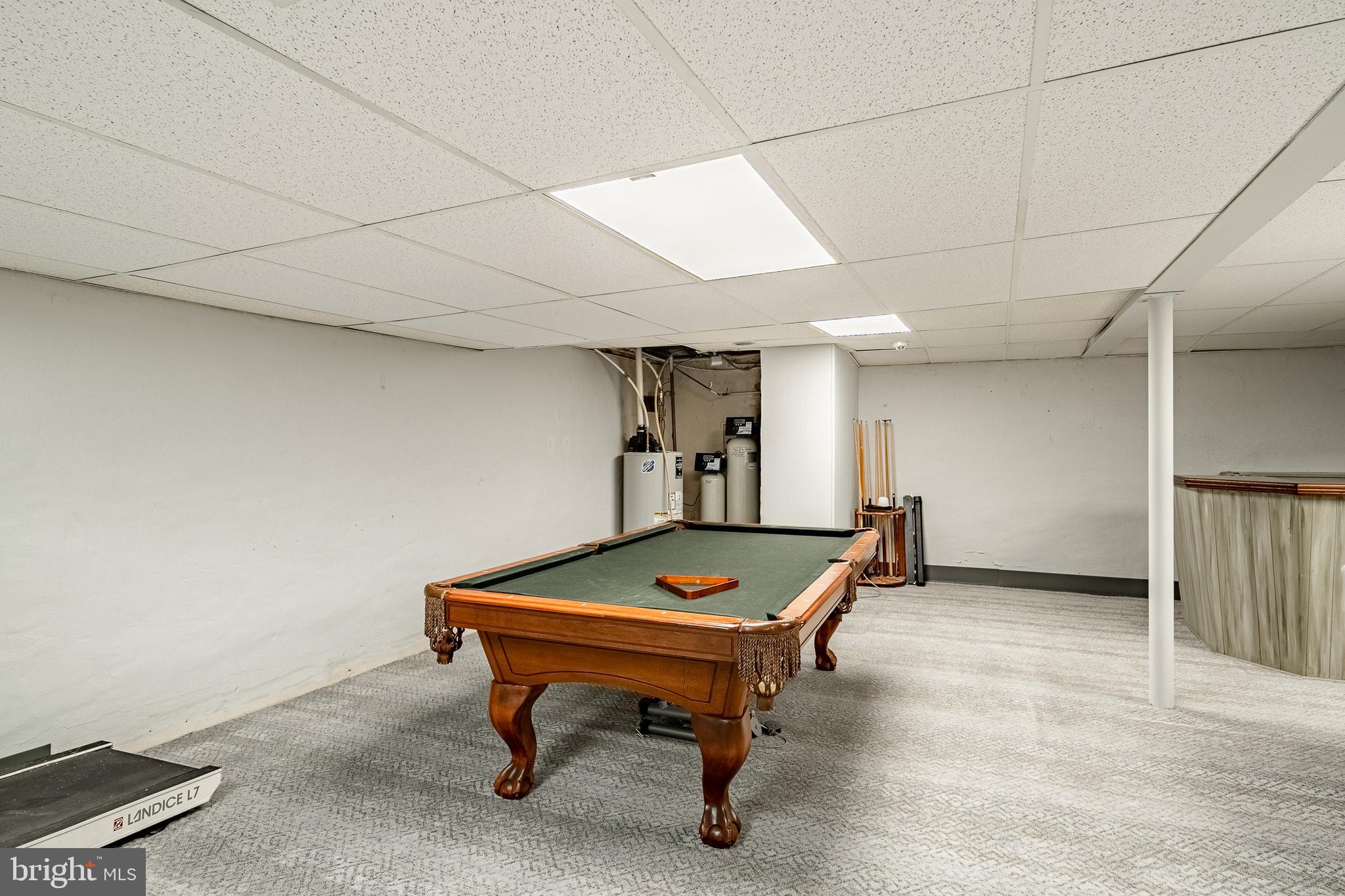 3920 Darby Road Bryn Mawr, PA 19010 - Photo 31 of 54 a living room with furniture pool table and a window