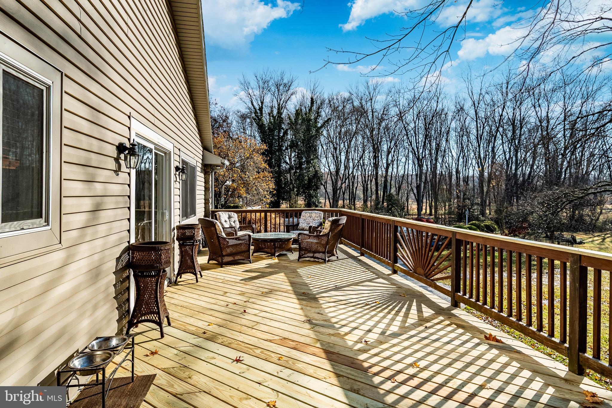 3920 Darby Road Bryn Mawr, PA 19010 - Photo 36 of 54 a view of balcony with chairs and wooden fence