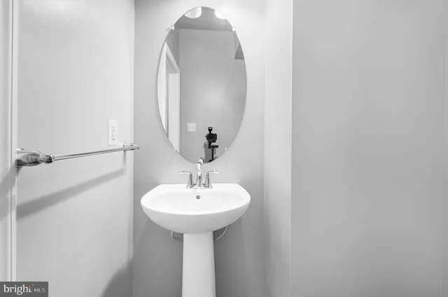 a close view of a sink and a mirror
