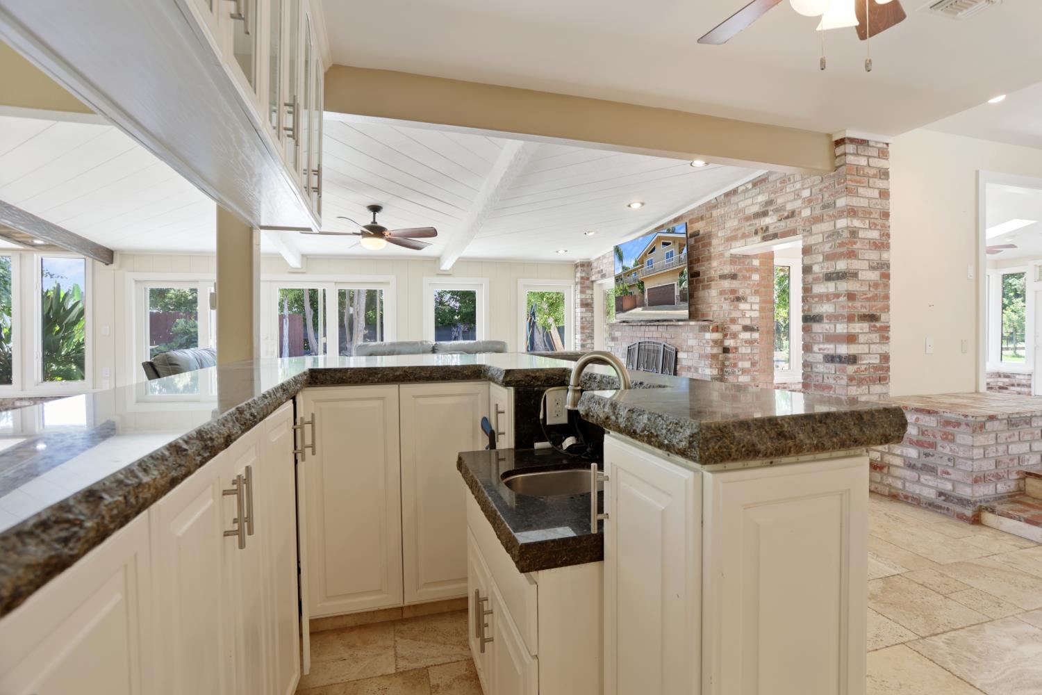 9935 Hazel Road Stockton, CA 95212 - Photo 17 of 98 a kitchen with granite countertop a sink and cabinets