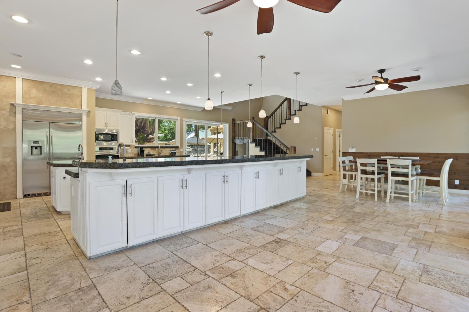 9935 Hazel Road Stockton, CA 95212 - Photo 22 of 98 a kitchen with stainless steel appliances kitchen island granite countertop a sink and cabinets