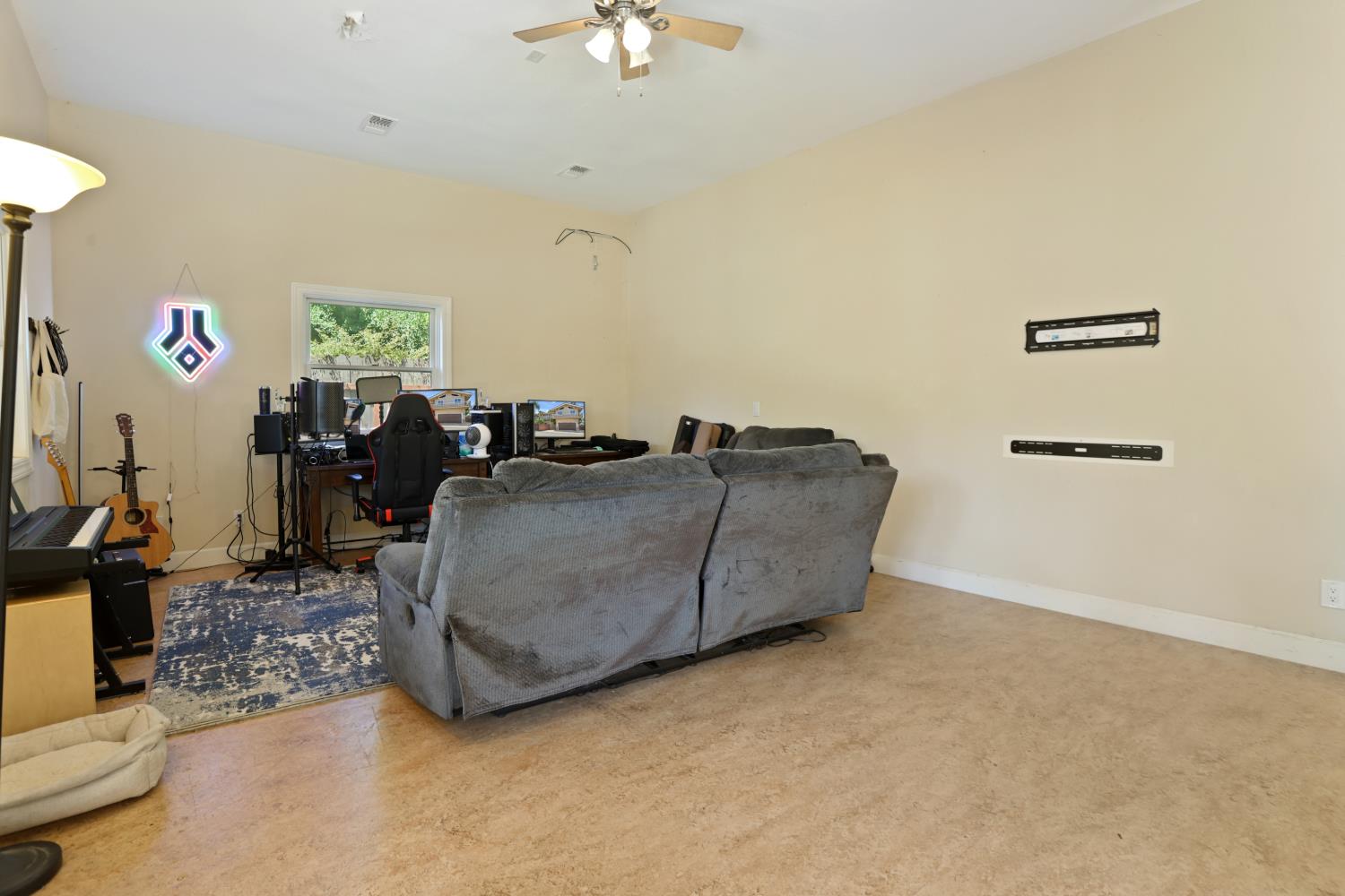 9935 Hazel Road Stockton, CA 95212 - Photo 40 of 98 a living room with furniture and a flat screen tv