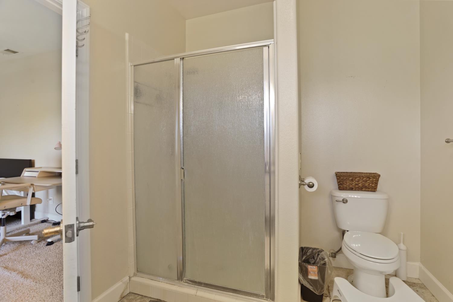 9935 Hazel Road Stockton, CA 95212 - Photo 50 of 98 a bathroom with a toilet and a shower