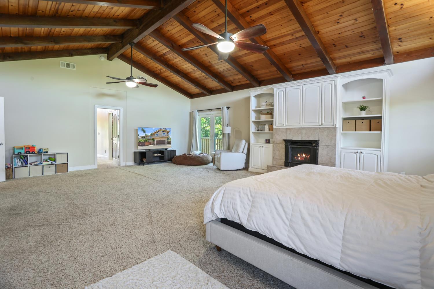 9935 Hazel Road Stockton, CA 95212 - Photo 59 of 98 a spacious bedroom with a bed and a couch