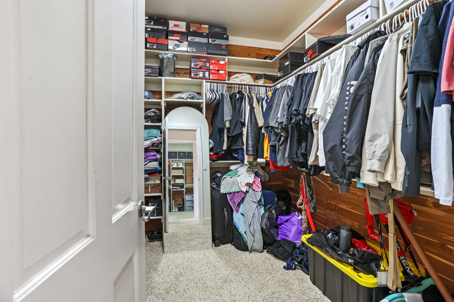 9935 Hazel Road Stockton, CA 95212 - Photo 61 of 98 a view of walk in closet with clothes and shoes