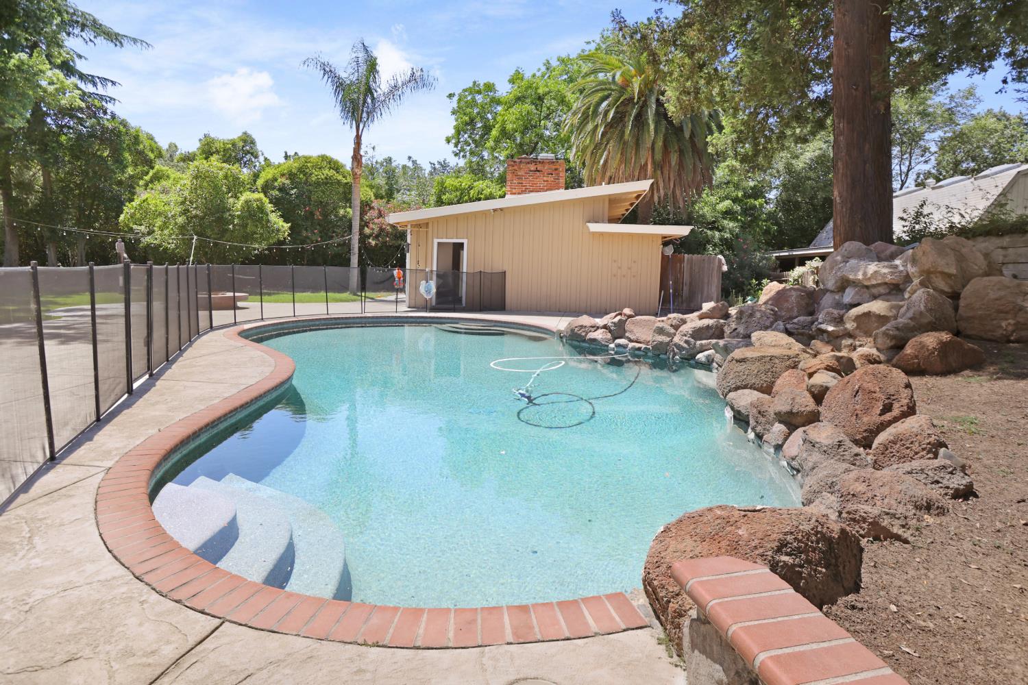 9935 Hazel Road Stockton, CA 95212 - Photo 78 of 98 a view of a swimming pool with a patio