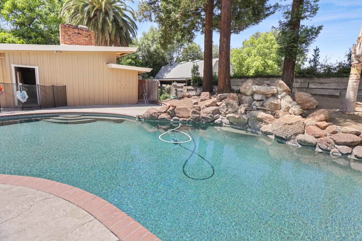 9935 Hazel Road Stockton, CA 95212 - Photo 95 of 98 a backyard of a house with table and chairs