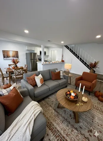 a room with wooden floor and furniture