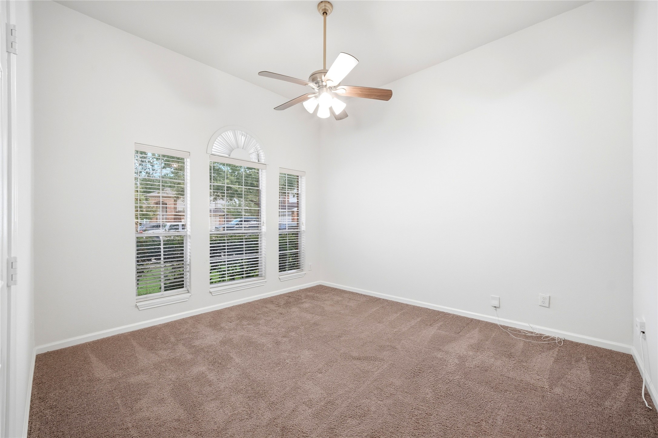 5411 Gate Canyon Court Spring, TX 77373 - Photo 33 of 33 an empty room with windows and fan