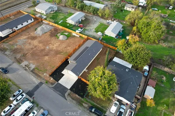 an aerial view of house with yard