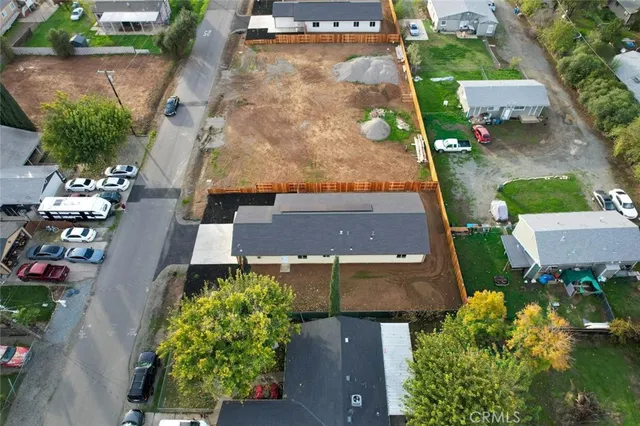 an aerial view of a house with a garden