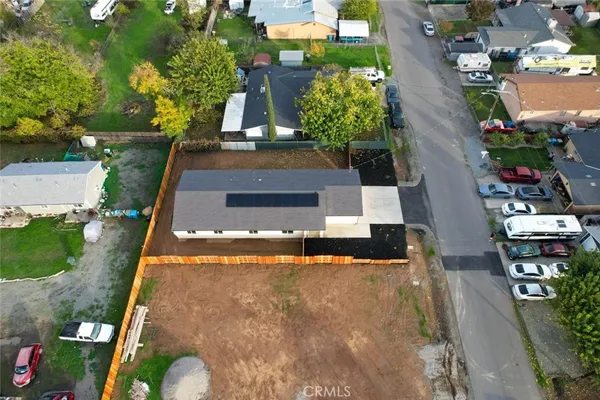 an aerial view of residential houses with outdoor space