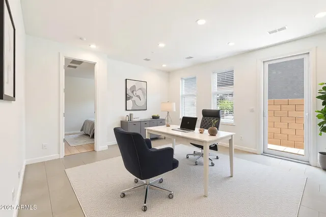 a kitchen with white cabinets and a stove