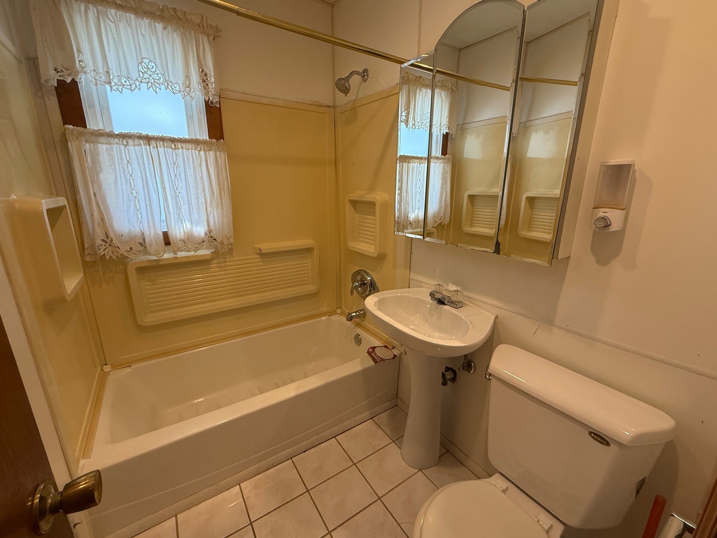 2521 Dakota Road Waukegan, IL 60087 - Photo 11 of 29 a bathroom with a sink a toilet and shower