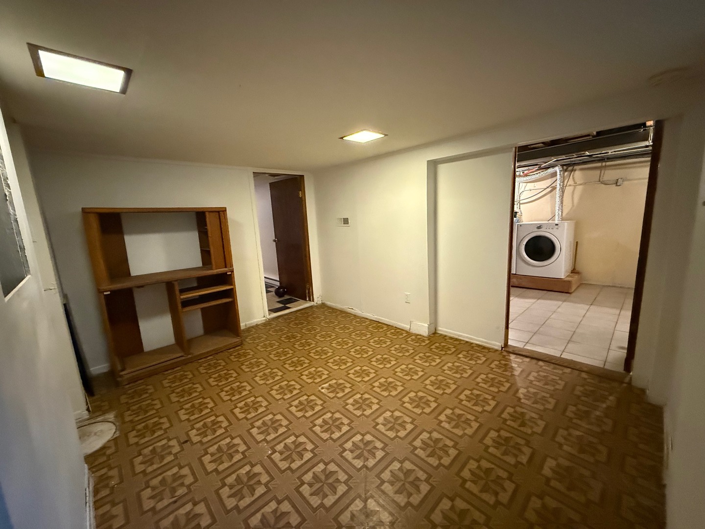2521 Dakota Road Waukegan, IL 60087 - Photo 19 of 29 a view of a hallway to a livingroom with furniture and front door