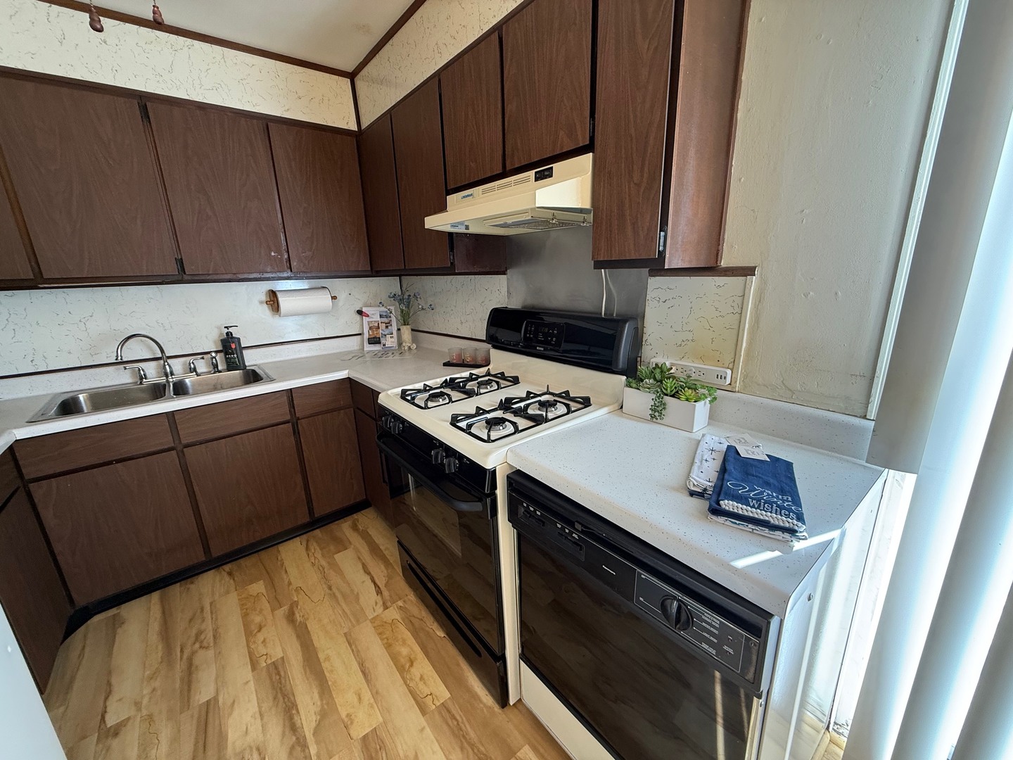 2521 Dakota Road Waukegan, IL 60087 - Photo 2 of 29 a kitchen with a sink stove and cabinets