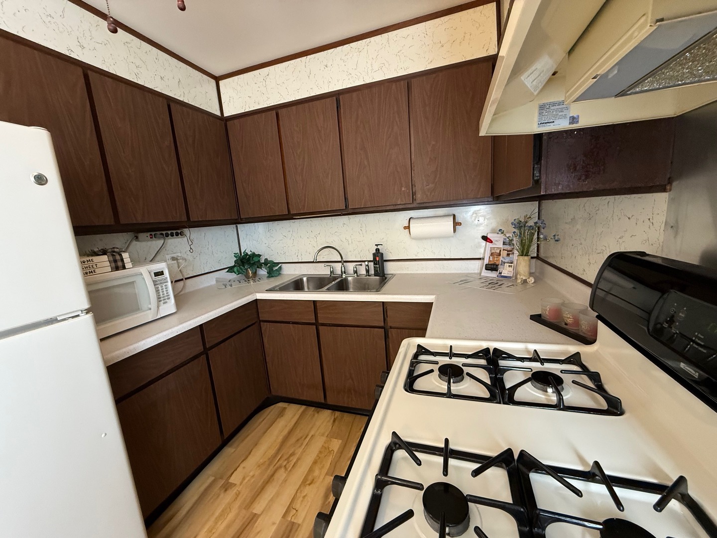 2521 Dakota Road Waukegan, IL 60087 - Photo 3 of 29 a kitchen with a sink a stove and cabinets