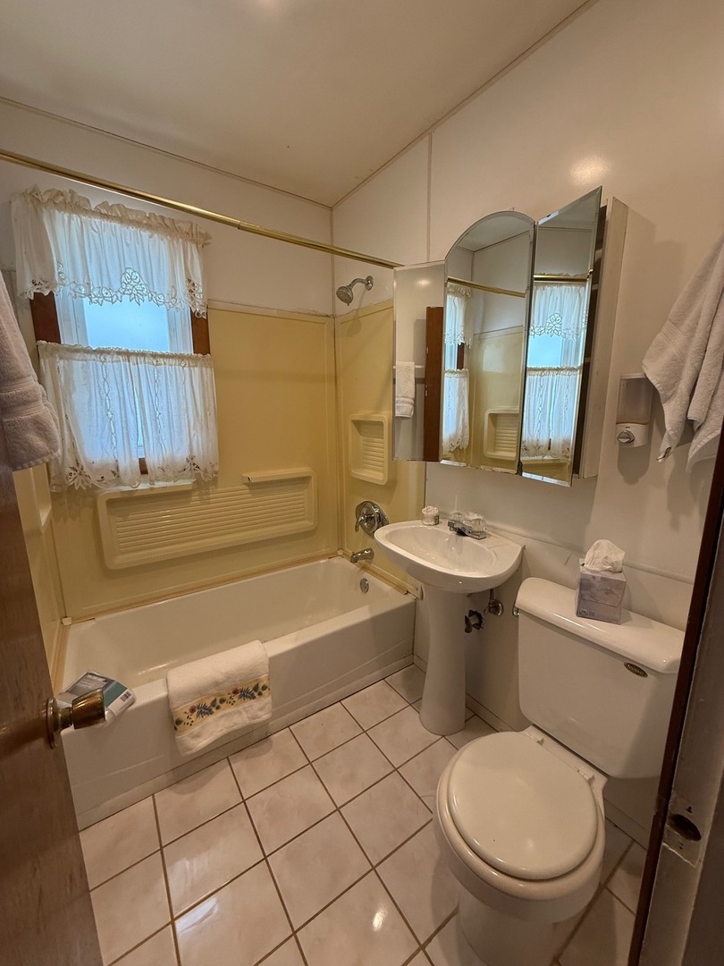 2521 Dakota Road Waukegan, IL 60087 - Photo 6 of 29 a bathroom with a sink toilet and shower