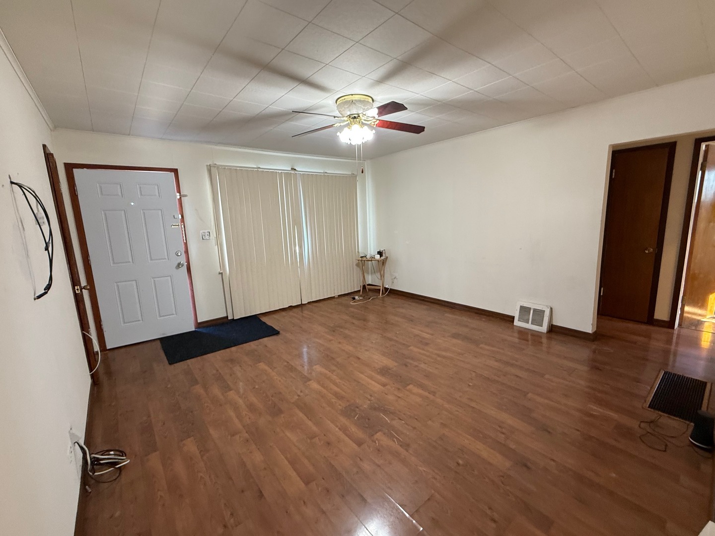 2521 Dakota Road Waukegan, IL 60087 - Photo 9 of 29 wooden floor in an empty room with a window