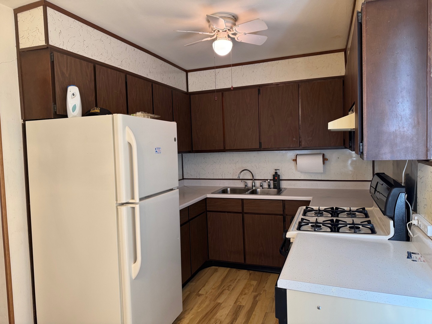 2521 Dakota Road Waukegan, IL 60087 - Photo 10 of 29 a white refrigerator freezer sitting inside of a kitchen