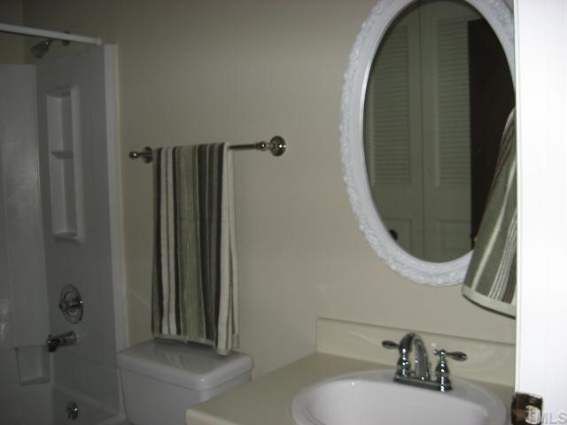 7721 Kingsberry Court Raleigh, NC 27615 - Photo 6 of 11 Nice tub/shower and new faucets in bathroom.