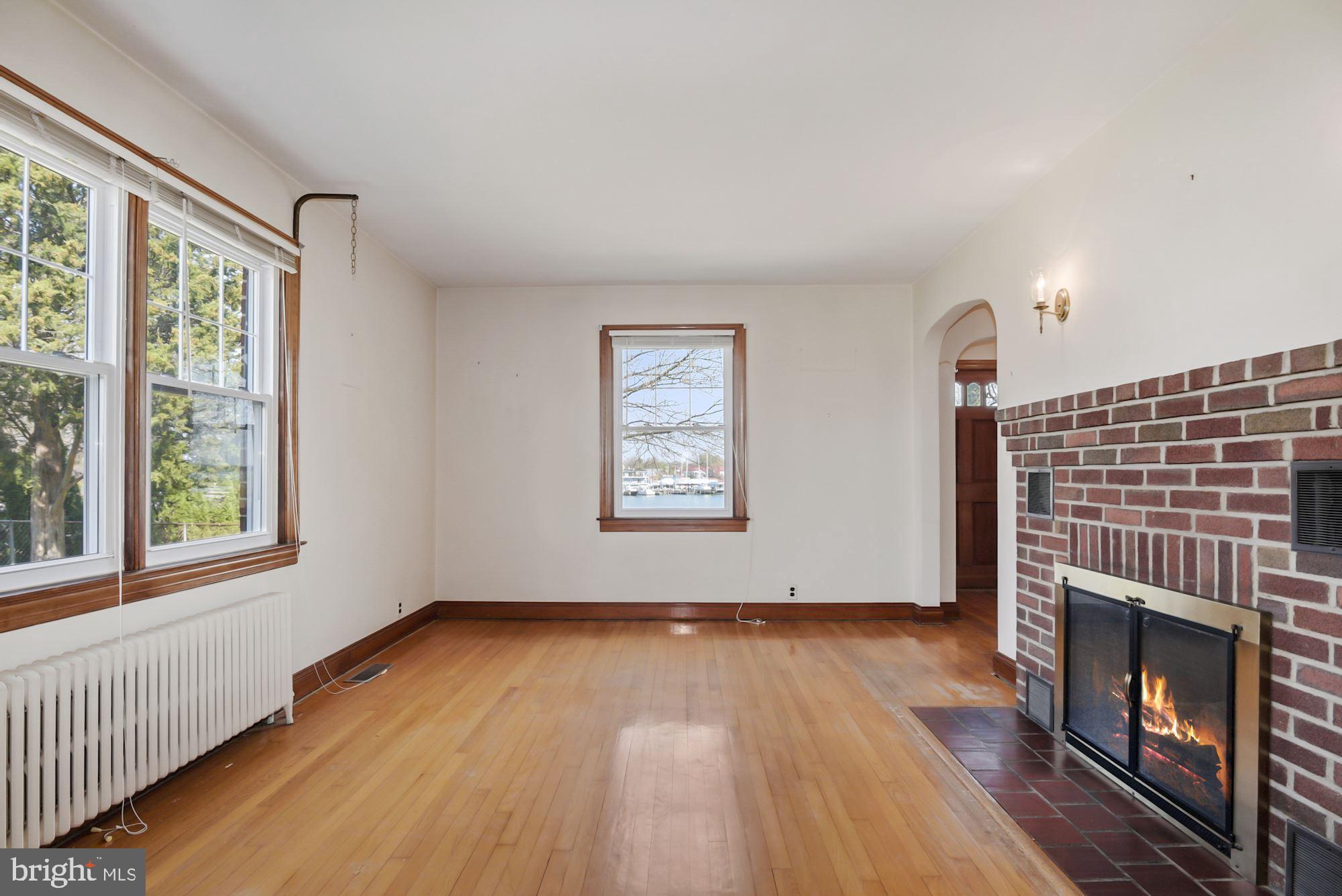 7046 Bembe Beach Road Annapolis, MD 21403 - Photo 3 of 38 Living Room with Wood Burning Fireplace