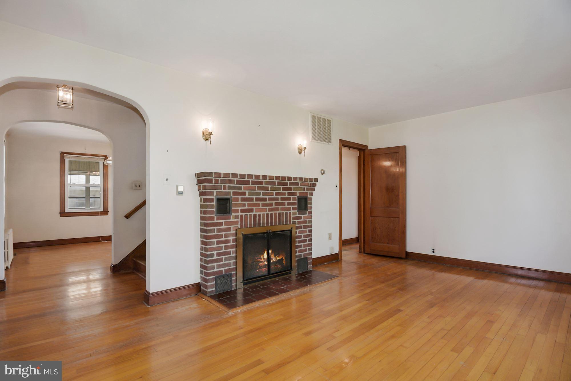 7046 Bembe Beach Road Annapolis, MD 21403 - Photo 10 of 38 Living Room with Wood Burning Fireplace