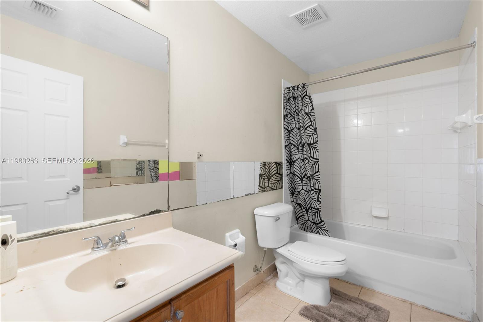 4628 Southwest 129th Avenue Miramar, FL 33027 - Photo 23 of 36 a bathroom with a sink a toilet and shower
