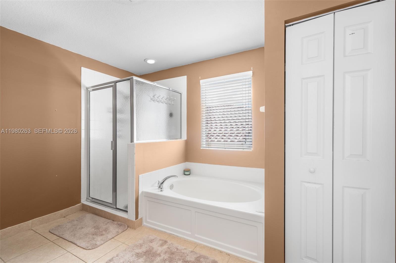4628 Southwest 129th Avenue Miramar, FL 33027 - Photo 33 of 36 a bathroom with a bathtub and a shower