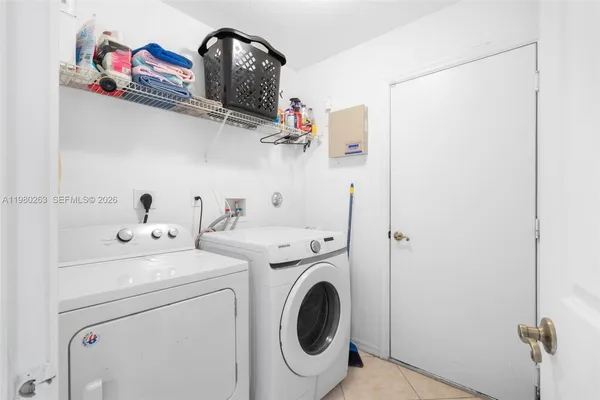 a utility room with dryer and washer