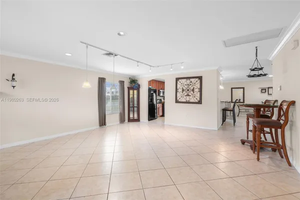 a view of a livingroom with furniture and lots of furniture